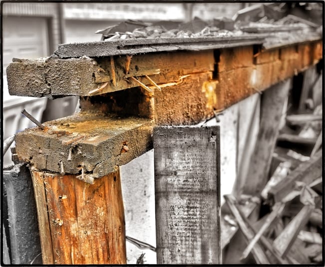 posts supporting the notched sill plate with mortised end