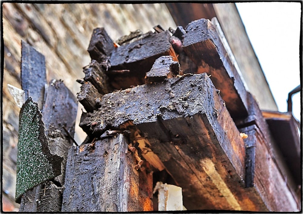 close up of a circular-sawn timber (resting on two dimensional studs) with exposed tenon