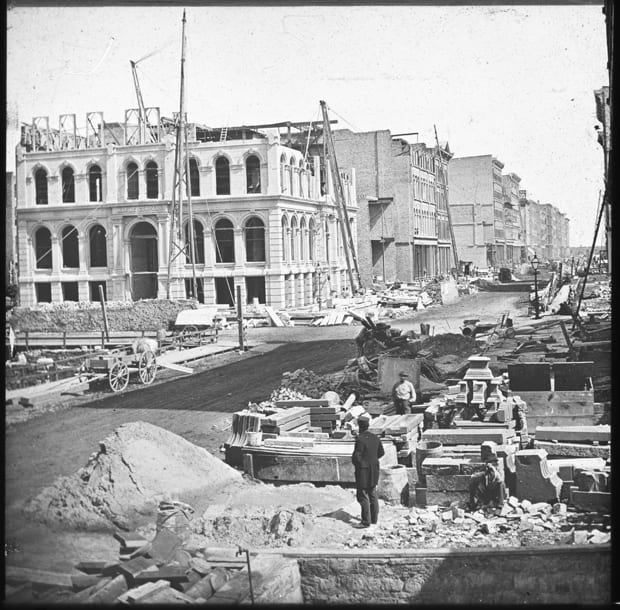 Rebuilding the Marine Building, located on the northeast corner of Lake and LaSalle Streets, after its destruction during the Chicago Fire of 1871, Chicago, Illinois, circa 1873.